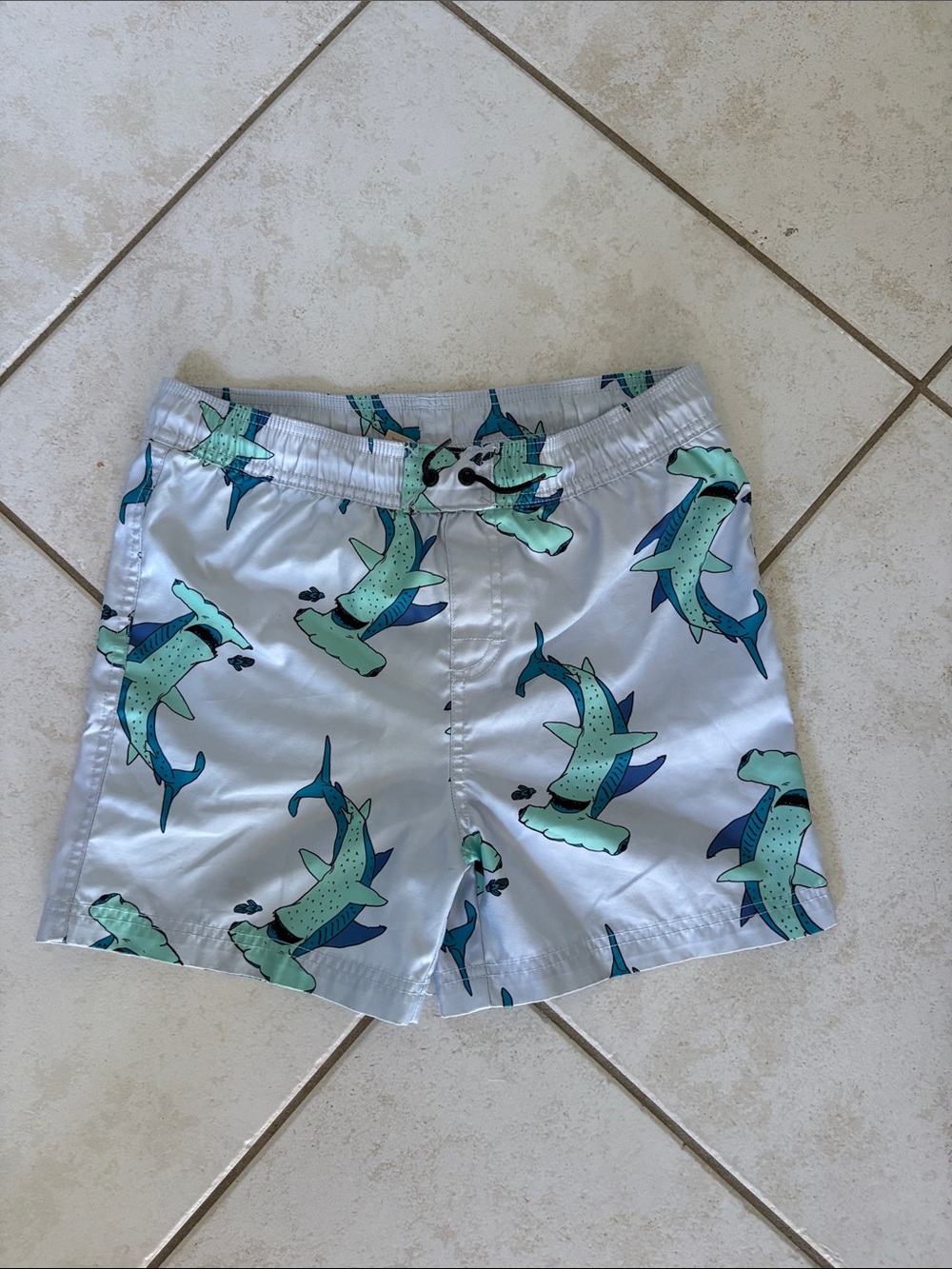 Tea Collection Light Blue Swim Trunks with Teal and Navy Shark Motif